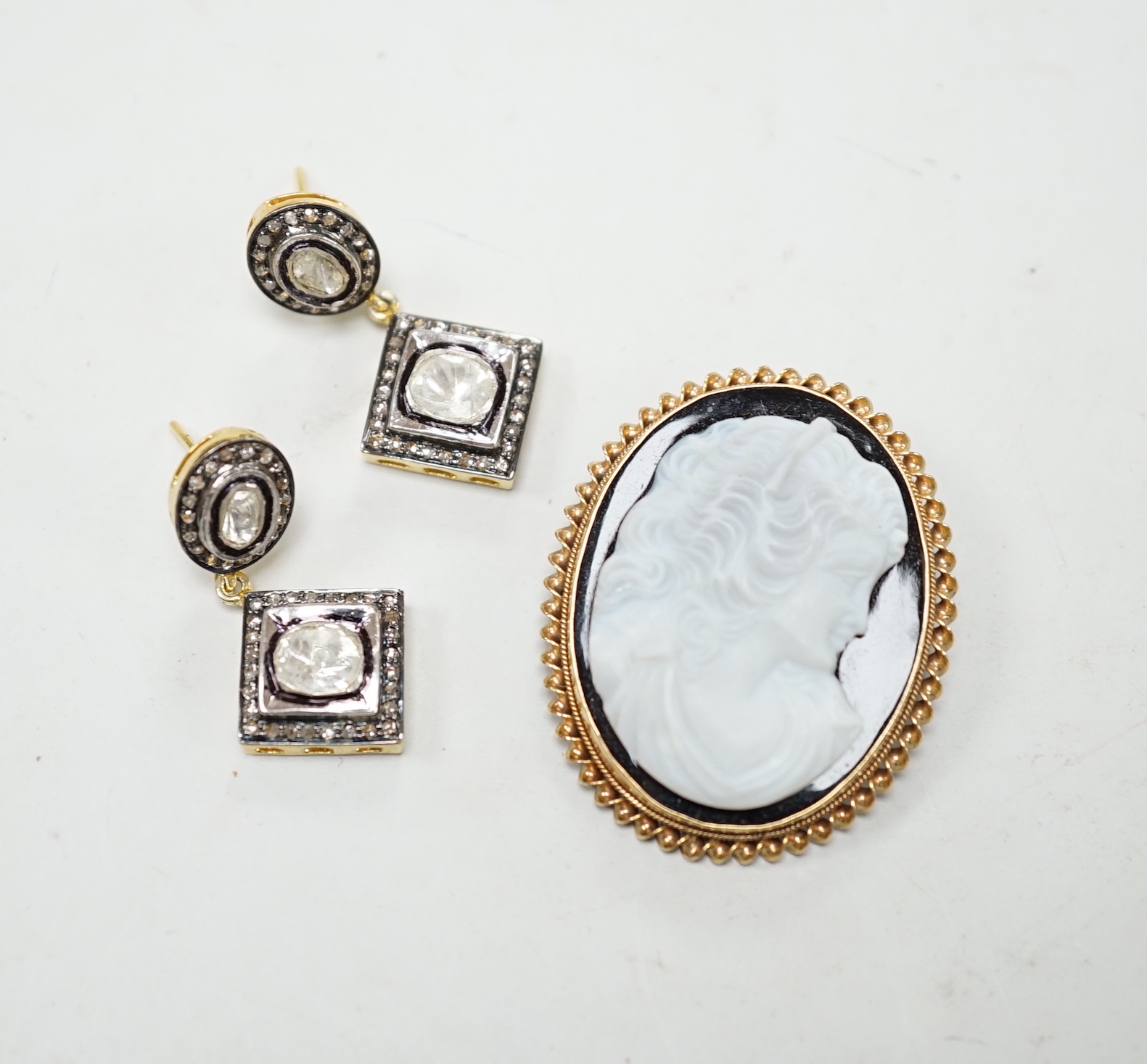 A modern 9ct gold mounted oval cameo hardstone brooch, 40mm and a pair of gilt 925 and diamond set drop earrings.